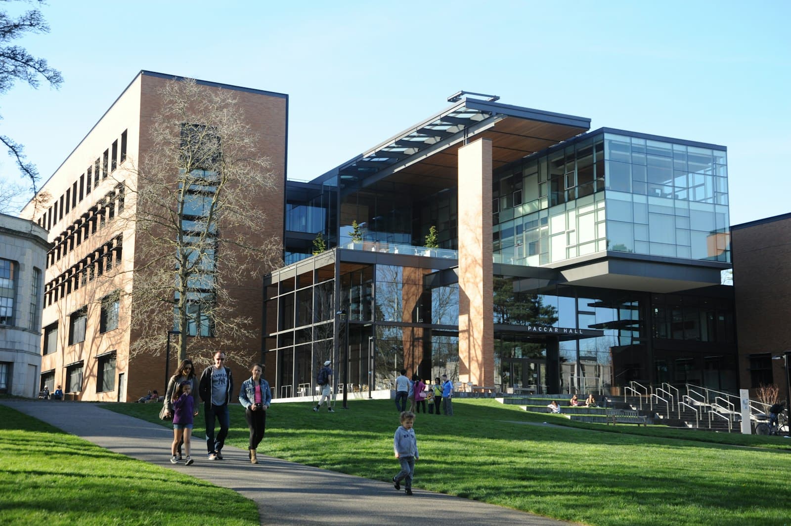 Students walking near a college building, representing Logic Education's institute