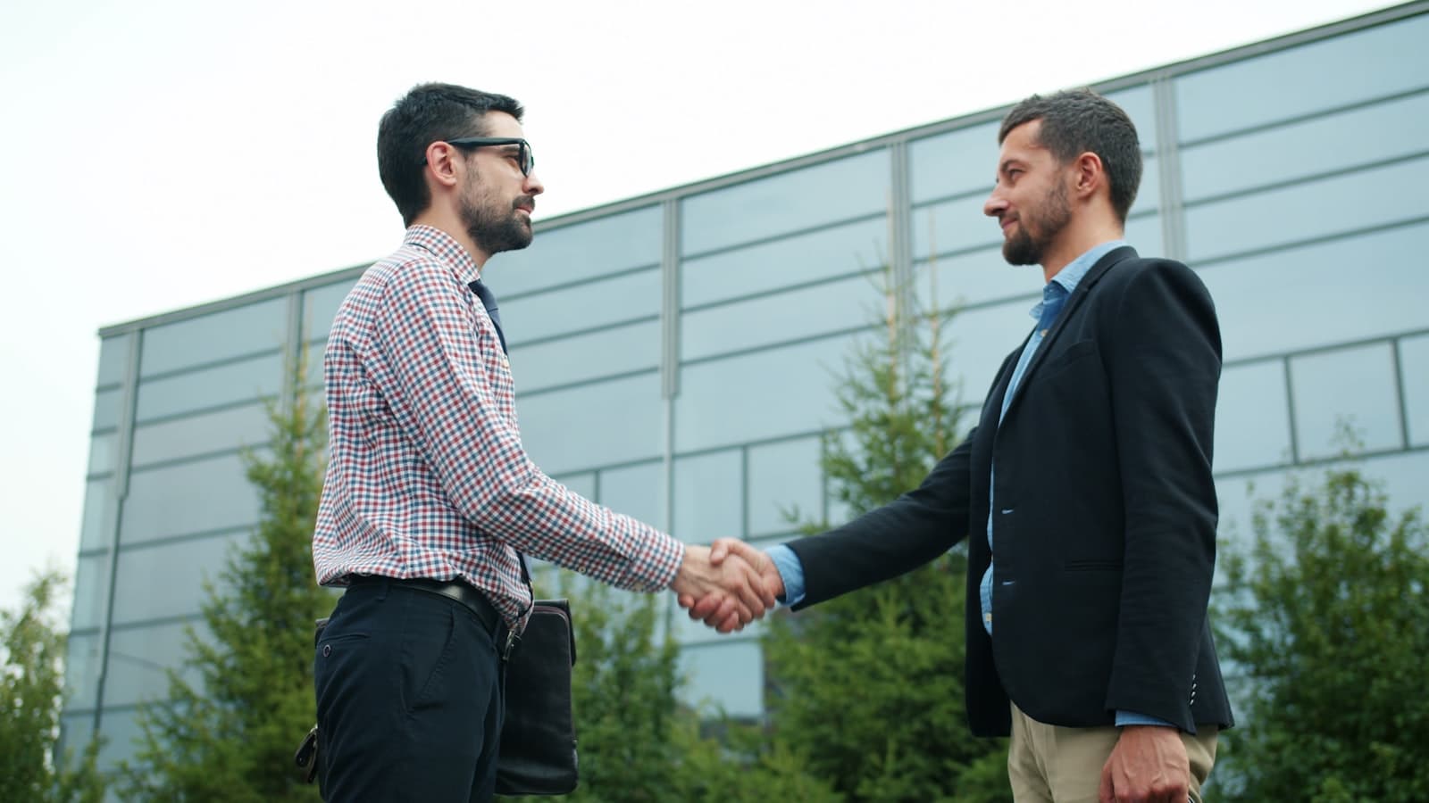 Business professionals connecting at a networking event, representing IBG Network's member community